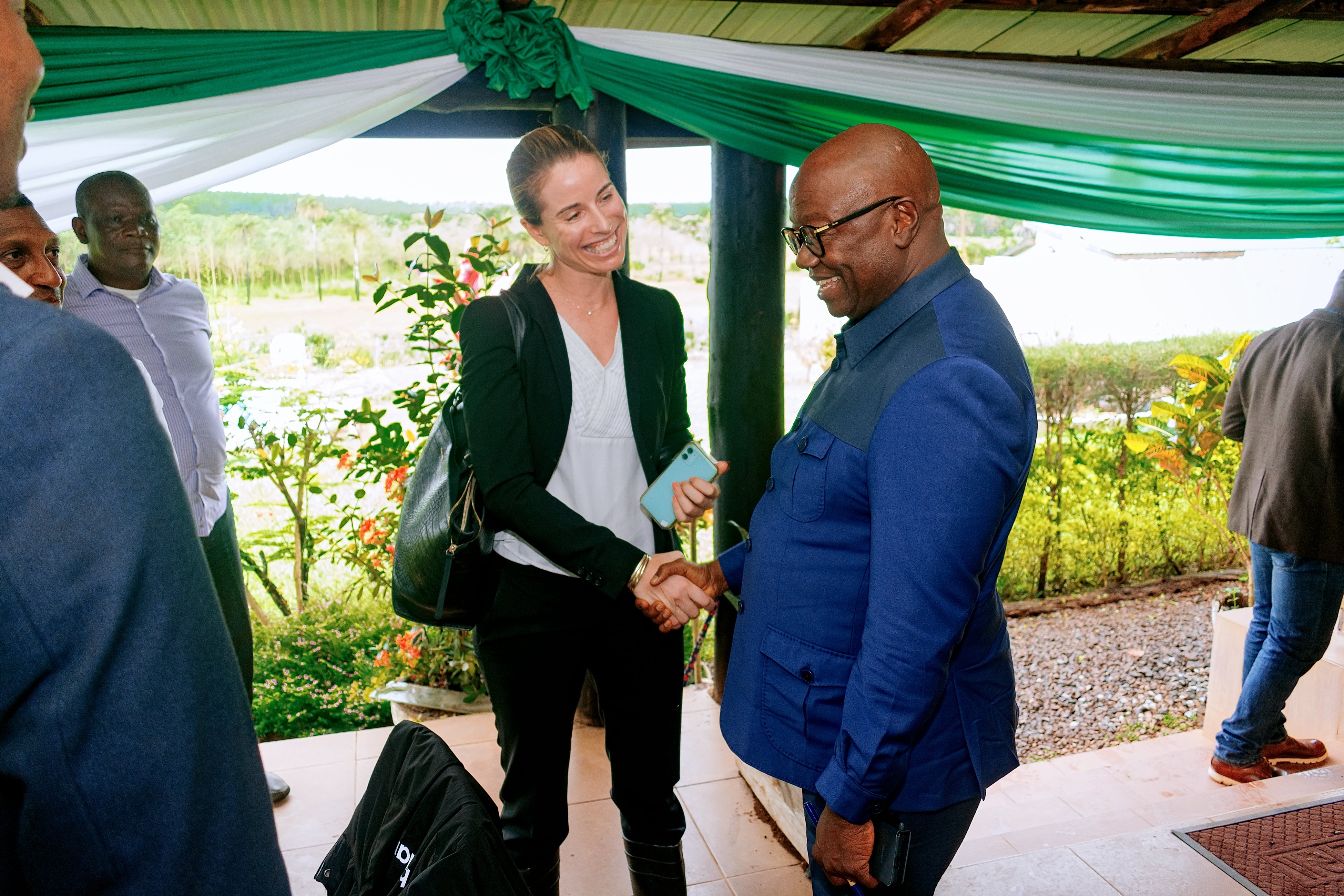 Tessa Lee, Chief Regulatory Officer at CrossBoundary Energy, shakes the hand of Sierra Leone's Minister of Energy, Alhaji Kanja Sesay